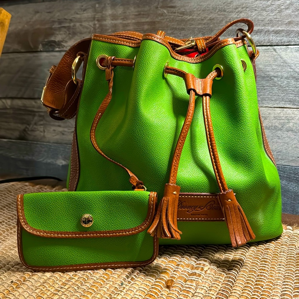Dooney & Bourke grass green drawstring bag. New Vintage. Registration included